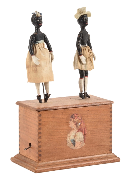 EARLY IVES CLOCKWORK DANCERS TOY ON WOODEN BOX. 