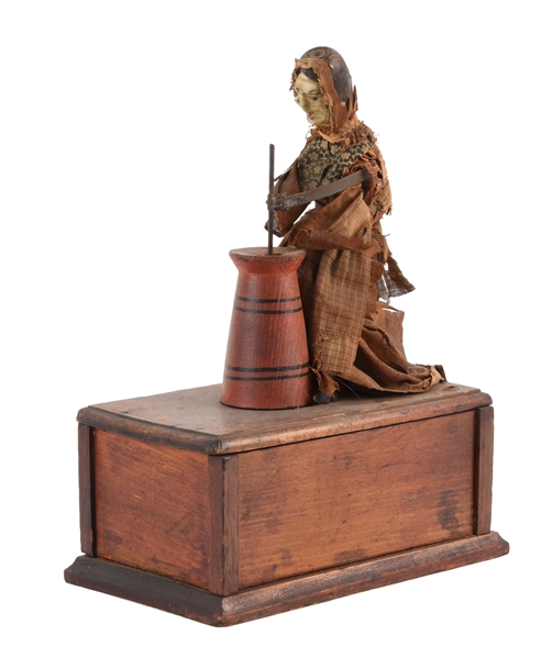 EARLY IVES CLOCKWORK WOMAN BUTTER CHURNER TOY ON WOODEN BASE. 