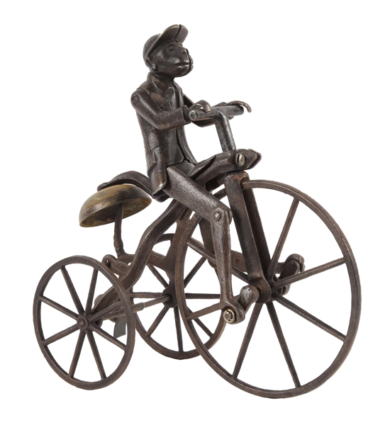 CAST IRON J. & E. STEVENS MONKEY HIGH WHEELED BICYCLE TOY.