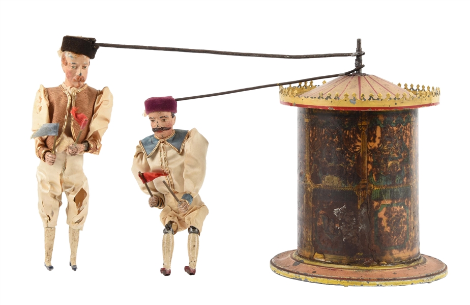 EARLY BRITAINS CLOCKWORK RACE TOY.