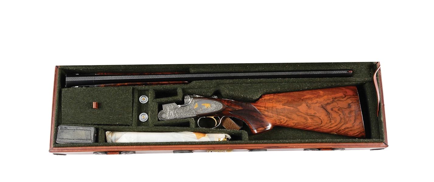 (M) VERY RARE AND NICELY FINISHED 70S VINTAGE BERETTA S06 EELL OVER UNDER GAME SHOTGUN WITH SUPERB RELIEF SCROLL AND GOLD INLAID DOG SCENES BY TIMPINI AND GOLINI WITH CASE.