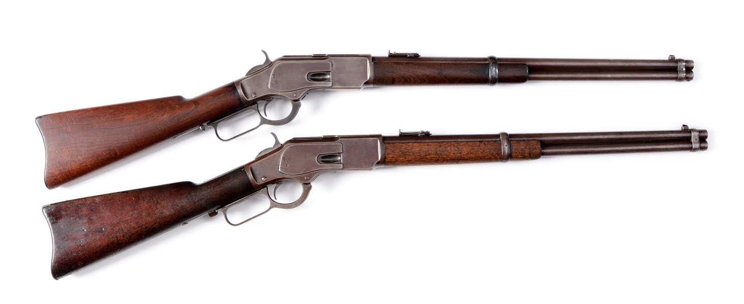 (A) CONSECUTIVE PAIR OF WINCHESTER MODEL 1873 LEVER ACTION CARBINES - VICTORIAN PRISON SYSTEM (1884).