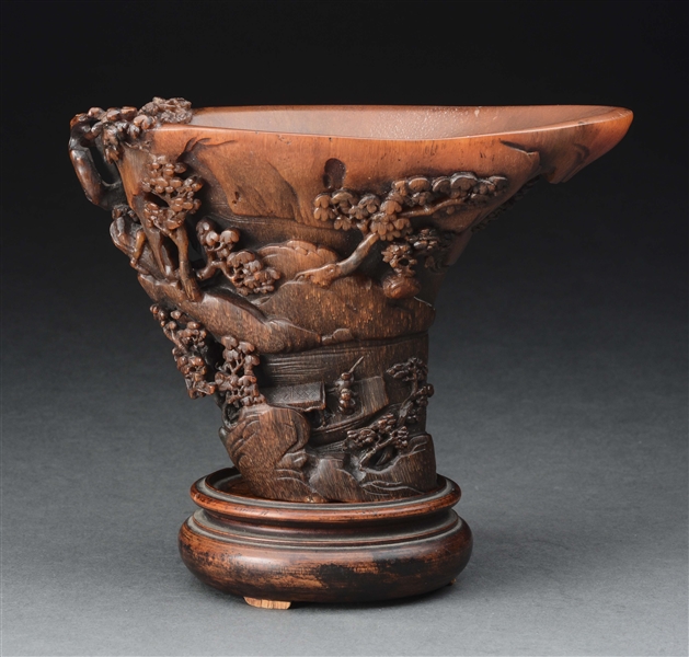 RARE & DELICATELY CARVED RHINOCEROS HORN LIBATION CUP.