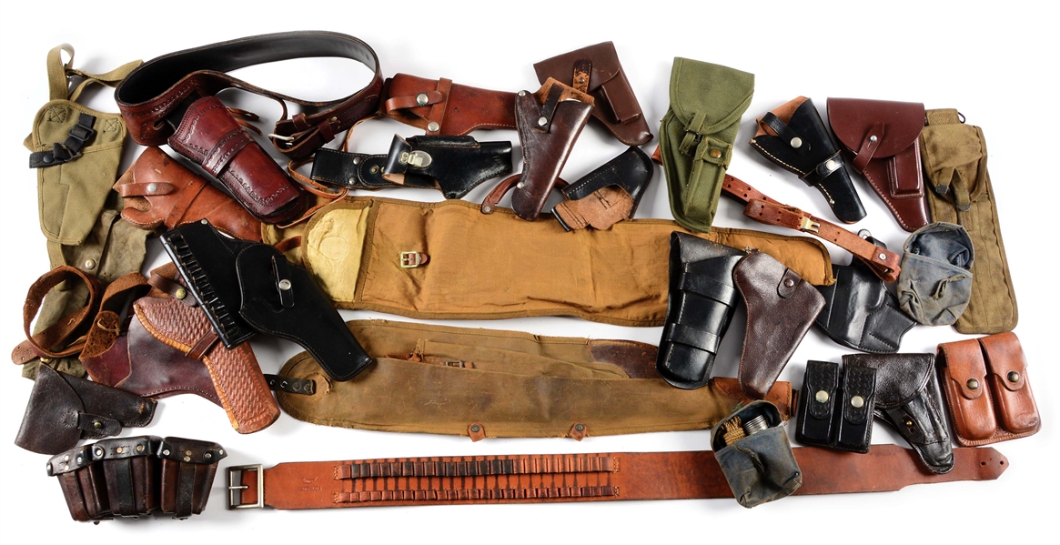 LARGE LOT OF ASSORTED HOLSTERS & ACCESSORIES.