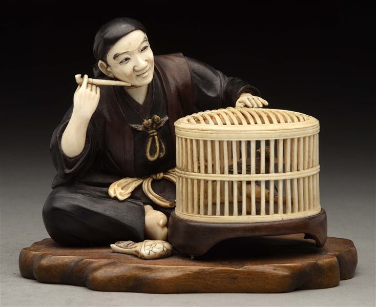 JAPANESE WOOD & IVORY MAN WITH BIRD CAGE ON WOODEN BASE.