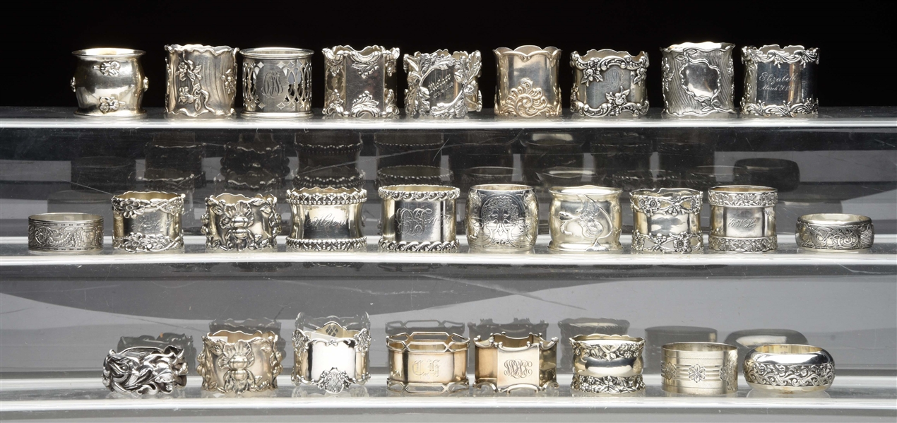 A LARGE GROUP OF AMERICAN STERLING NAPKIN RINGS. 