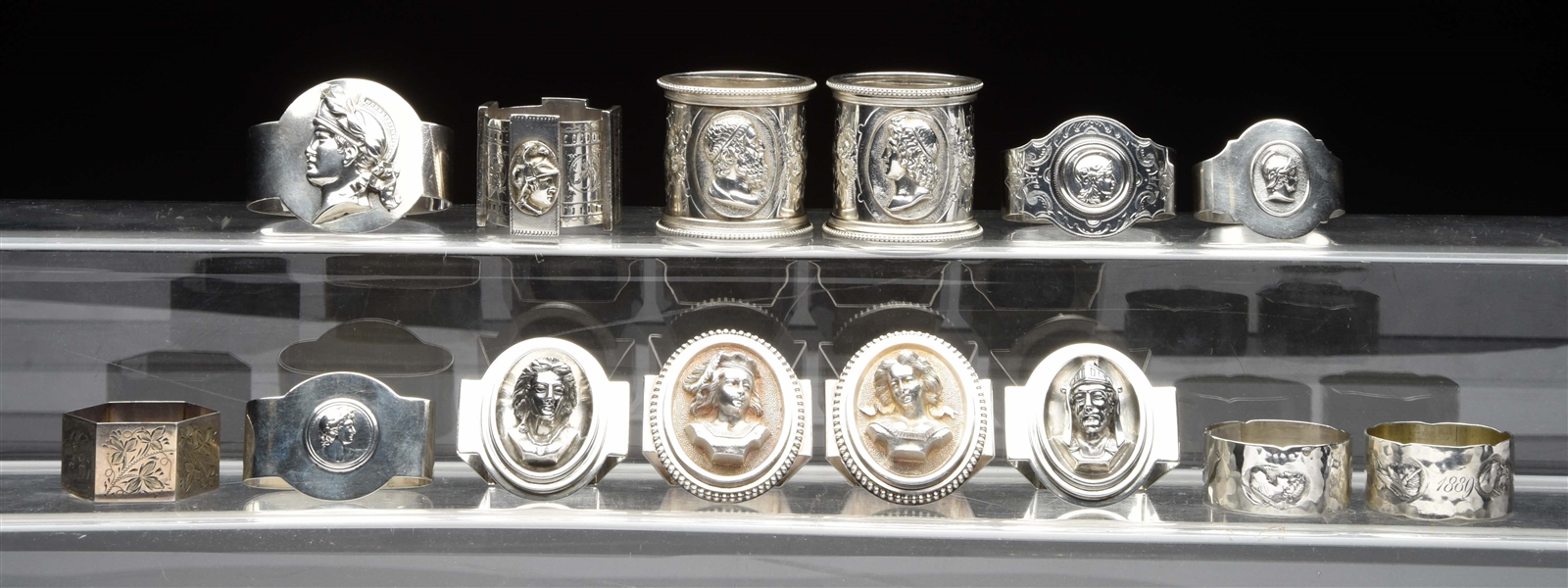 A GROUP OF STERLING MEDALLION NAPKIN RINGS. 