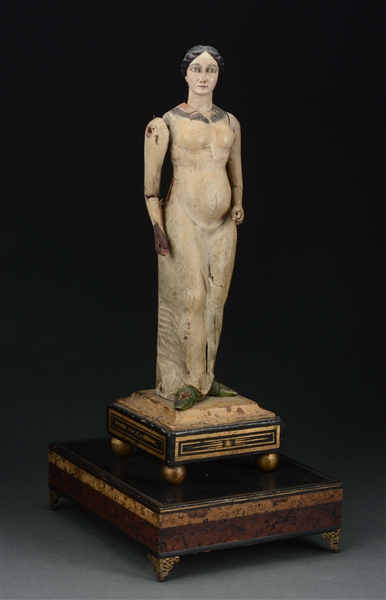 RARE CARVED AND DECORATED MECHANICAL FIGURE OF A WOMAN IN LONG DRESS.