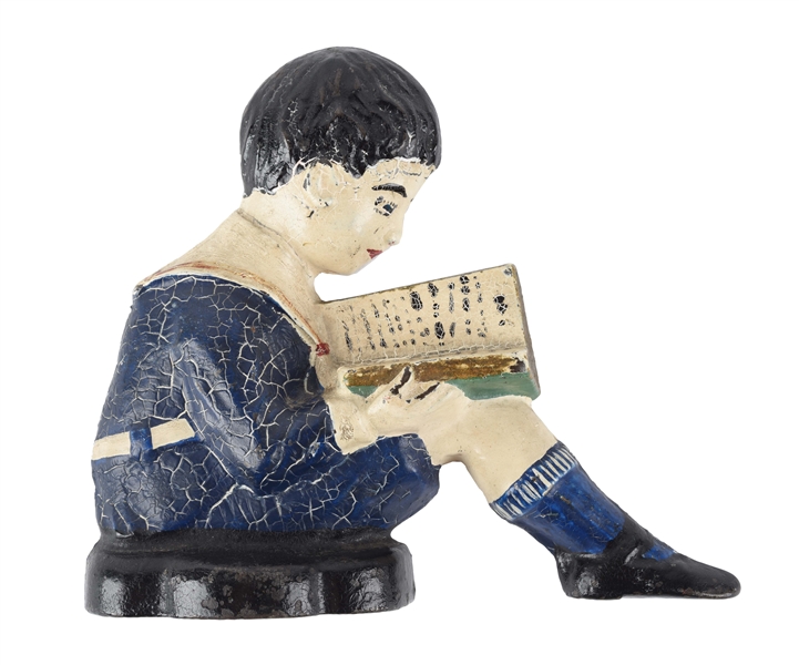 CAST IRON BOY READING BOOK BOOKEND.