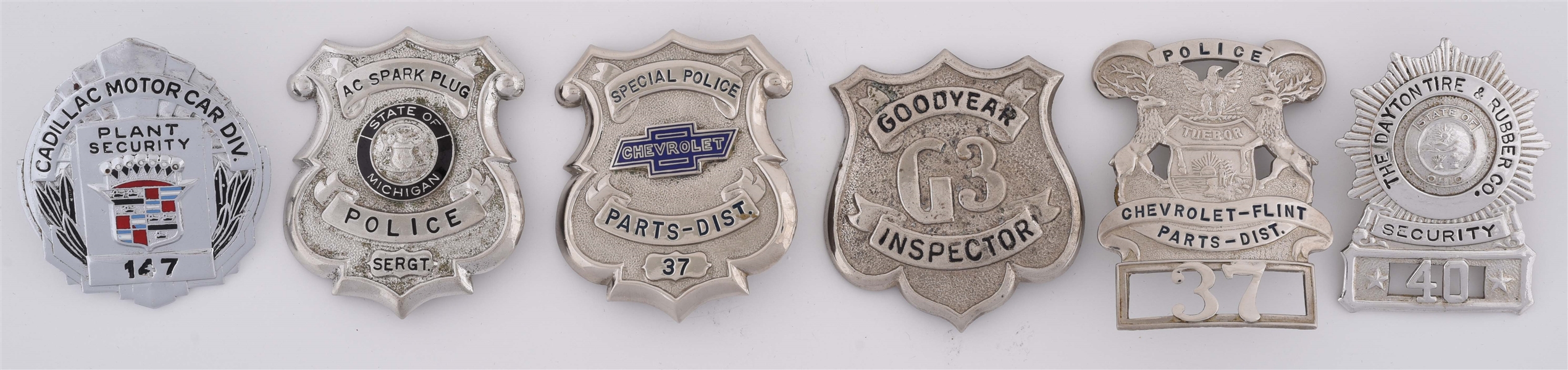 LOT OF 6: METAL ADVERTISING BADGES FROM GOODYEAR, CADILLAC & CHEVROLET. 