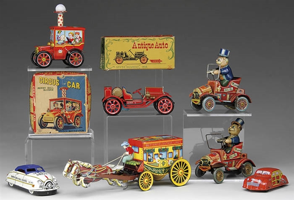 LOT OF SEVEN WIND-UP TIN VEHICLES                                                                                                                                                                       