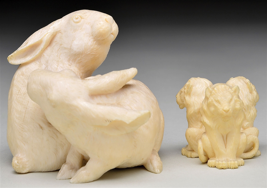 TWO IVORY CARVINGS RABBITS & LIONS                                                                                                                                                                      