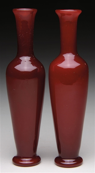 TWO NUMBERED TIFFANY RED VASES                                                                                                                                                                          