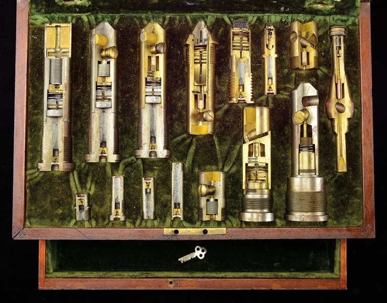 CASED SET OF FIFTEEN CUTAWAY FUSES REPORTEDLY INVENTED OR REDESIGNED BY REAR ADMIRAL RALPH EARLE.                                                                                                       