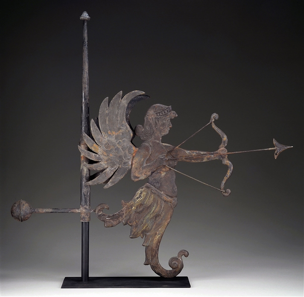RARE AND IMPORTANT FIGURAL WINGED ARCHER ARCHITECTURAL ROOF ORNAMENT.                                                                                                                                   