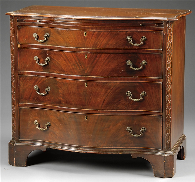 GEORGIAN FOUR-DRAWER SERPENTINE CHEST OF DRAWERS WITH BRUSHING SLIDE.                                                                                                                                   