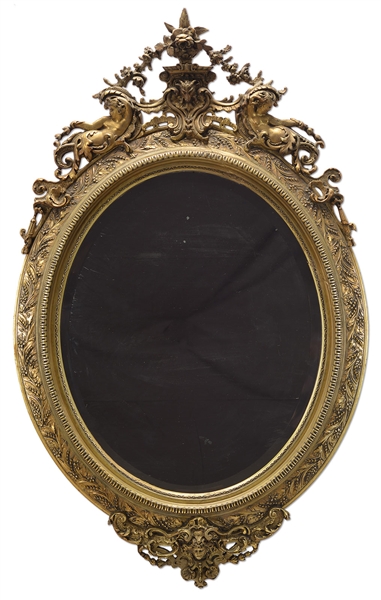 ROCOCO CARVED GILT OVAL MIRROR.                                                                                                                                                                         
