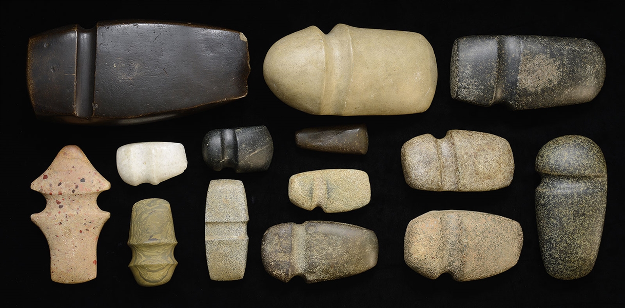 LOT OF FOURTEEN PREHISTORIC STYLE STONE AX HEADS                                                                                                                                                        