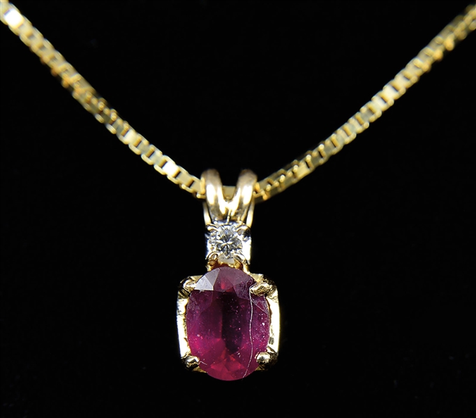RUBY AND DIAMOND PENDANT ON A 14KT YELLOW GOLD NECKLACE.                                                                                                                                                