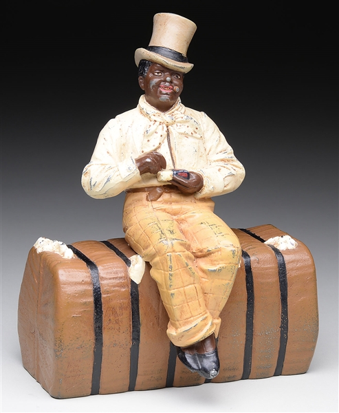 RARE AFRICAN AMERICAN MAN SEATED ON COTTON BALE DOORSTOP.                                                                                                                                               