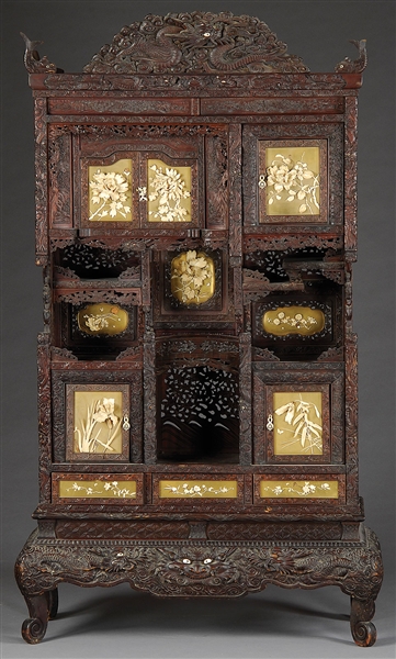 OUTSTANDING ORIENTAL CARVED HARDWOOD DISPLAY CABINET WITH ELABORATE CARVED IVORY MOUNTS.                                                                                                                