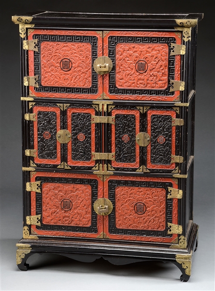 CARVED BLACK AND RED LACQUER CHEST.                                                                                                                                                                     