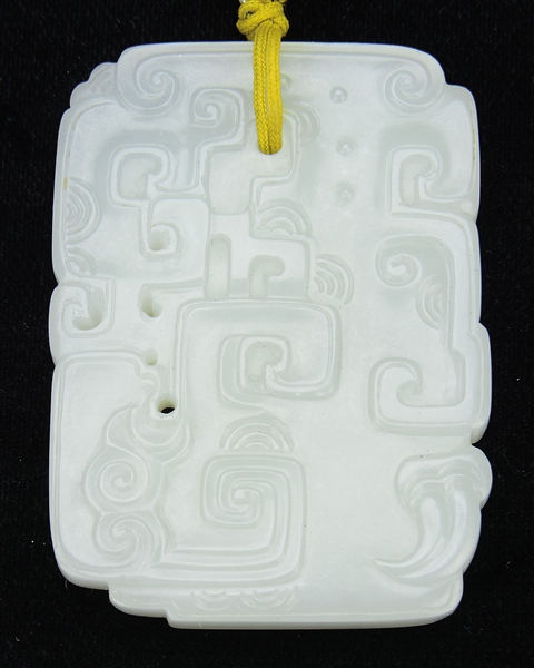 WHITE JADE CARVED ARCHAISTIC PENDANT.                                                                                                                                                                   