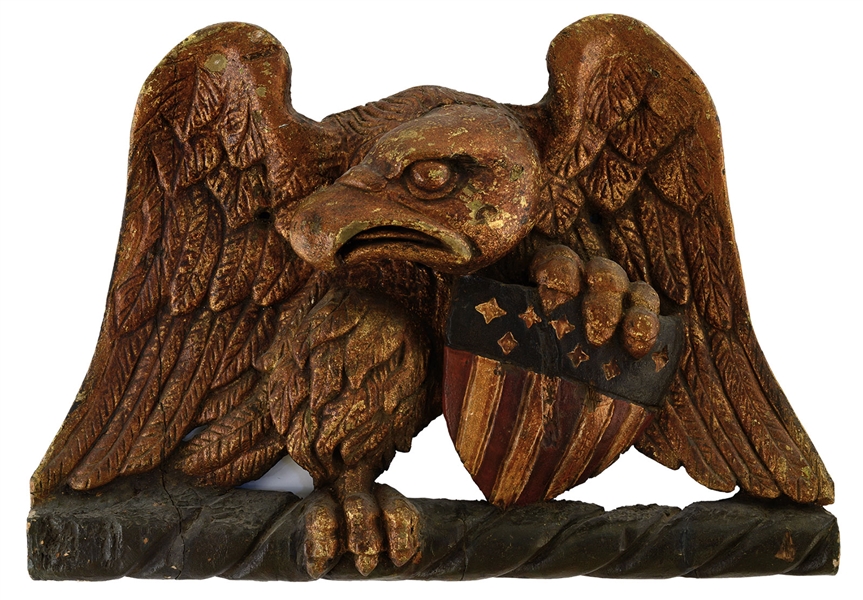 CARVED AND PAINTED SPREAD WING EAGLE AND SHIELD PLAQUE.                                                                                                                                                 