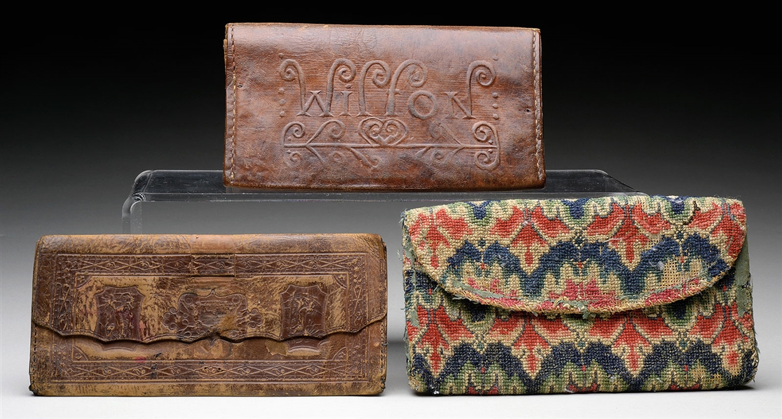LOT OF THREE EARLY WALLETS.                                                                                                                                                                             
