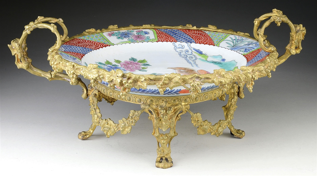 JAPANESE PORCELAIN CHARGER IN ORMOLU MOUNT.                                                                                                                                                             