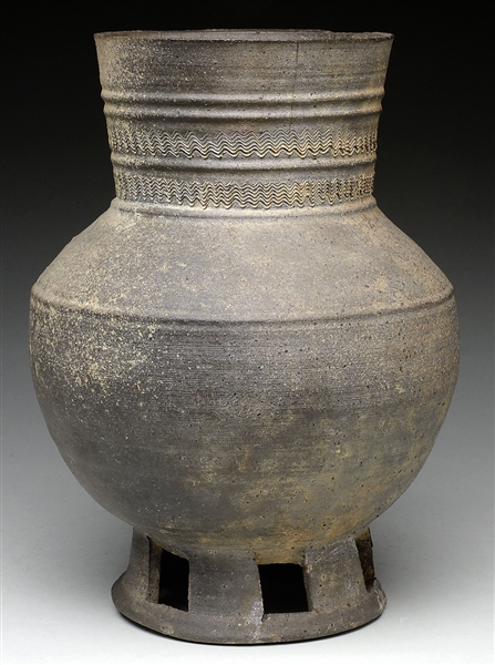 FOOTED POTTERY STORAGE JAR.                                                                                                                                                                             