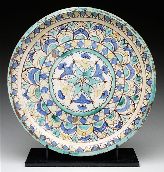 POLYCHROME FOOTED CERAMIC PLATE.                                                                                                                                                                        