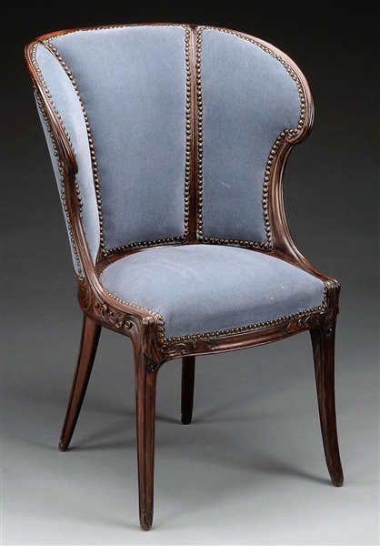 ART NOUVEAU BARREL BACK UPHOLSTERED ROSEWOOD WING CHAIR.                                                                                                                                                
