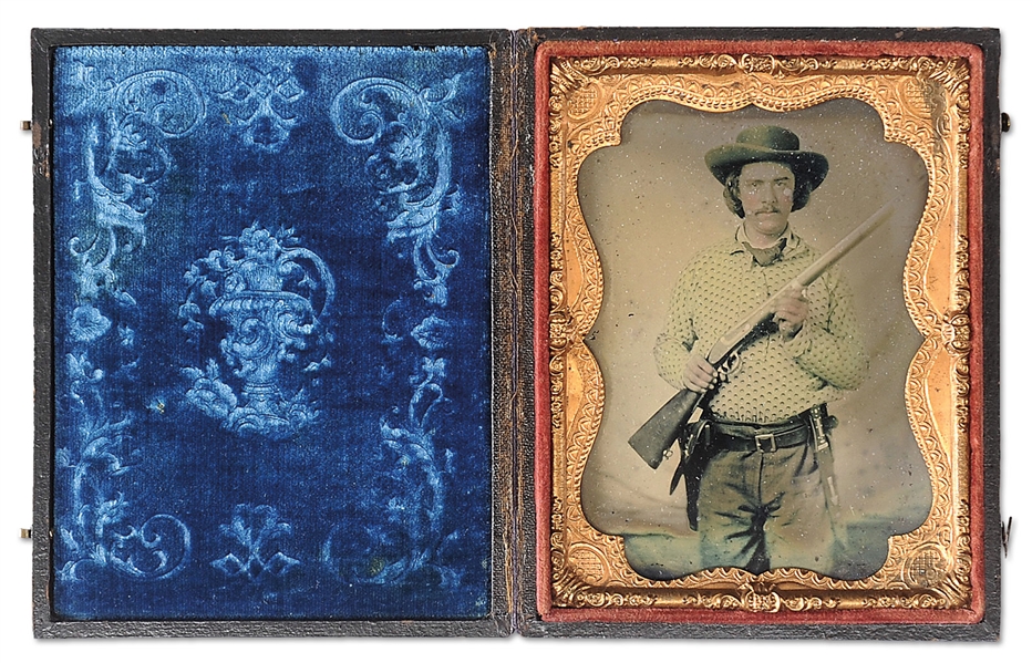 SPECTACULAR QUARTER PLATE AMBROTYPE OF WESTERN CONFEDERATE SOLDIER WITH MUSKET, PISTOL AND BOWIE KNIFE.                                                                                                 