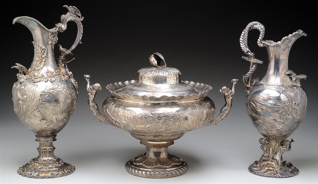 SPECTACULAR SET OF REPOUSSÉ AND ENGRAVED STERLING SILVER "TROPHIES" CONCERNING THE HEROIC ACTIONS OF TWO SAILORS INVOLVED IN THE SAVING OF THE STEAMSHIP SAN FRANCISCO, DECEMBER 24, 1853.              