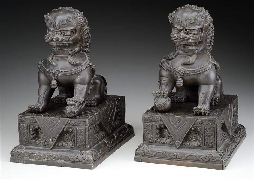 PAIR OF BRONZE SEATED FOO LIONS.                                                                                                                                                                        