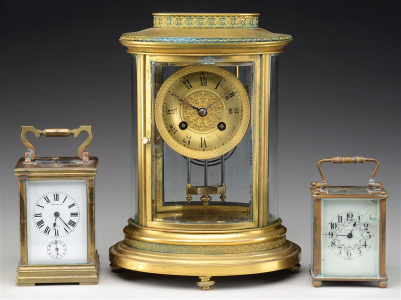 TWO FRENCH CARRIAGE CLOCKS TOGETHER WITH A CRYSTAL REGULATOR SHELF CLOCK.                                                                                                                               