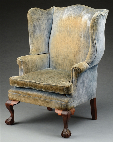 CHIPPENDALE STYLE BENCHMADE CARVED MAHOGANY BALL-AND-CLAW-FOOT WING CHAIR.                                                                                                                              
