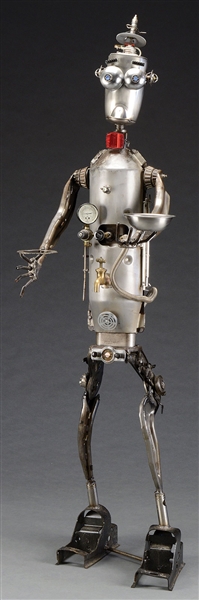 MODERN FOLK ART ROBOT MADE OF AUTOMOTIVE AND HOUSEHOLD ITEMS.                                                                                                                                           