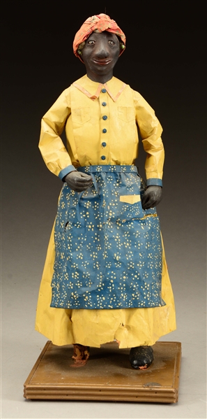 FOLK ART COMPOSITION AND CLOTH BLACK DOLL OF A WOMAN WITH BANDANNA. 