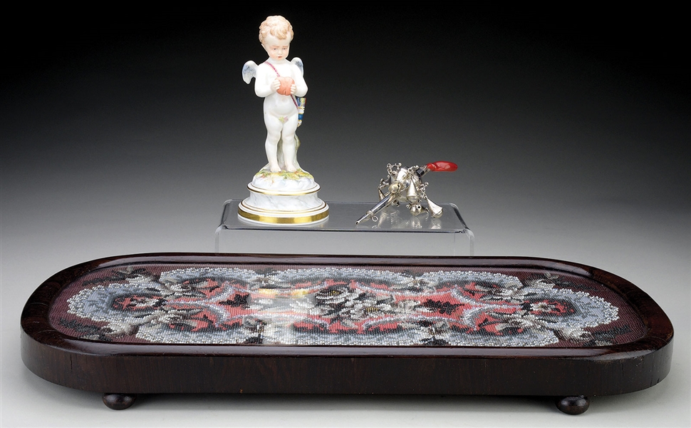RARE BEADWORK TRAY, ENGRAVED SILVER AND CORAL VICTORIAN BABYS RATTLE AND A MEISSEN FIGURINE OF CUPID.                                                                                                  