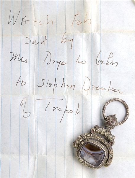 ANTIQUE WATCH FOB FROM ESTATE OF ADMIRAL MORTON L. DEYO WITH NOTE PURPORTING LINEAGE TO STEPHEN DECATUR.                                                                                                