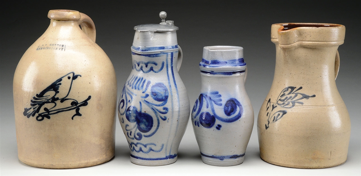THREE COBALT BLUE DECORATED STONEWARE PITCHERS AND A JUG.                                                                                                                                               