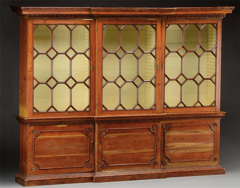RARE AND IMPORTANT GEORGE III CARVED PINE BREAKFRONT BOOKCASE.                                                                                                                                          