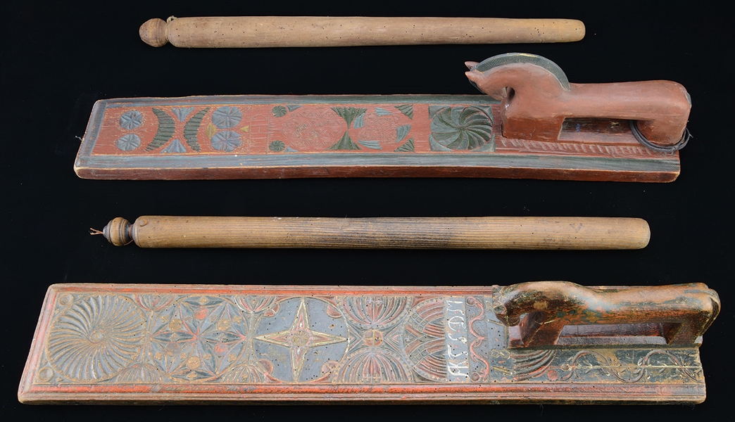 TWO CARVED AND PAINTED MANGLEBOARDS WITH HORSE SHAPED HANDLES, ACCOMPANIED BY TWO ROLLERS.                                                                                                              