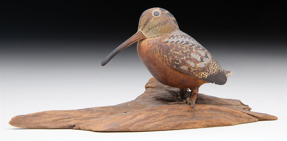 TWO CARVED AND PAINTED MINIATURE WOODCOCKS BY HAROLD GIBBS.                                                                                                                                             