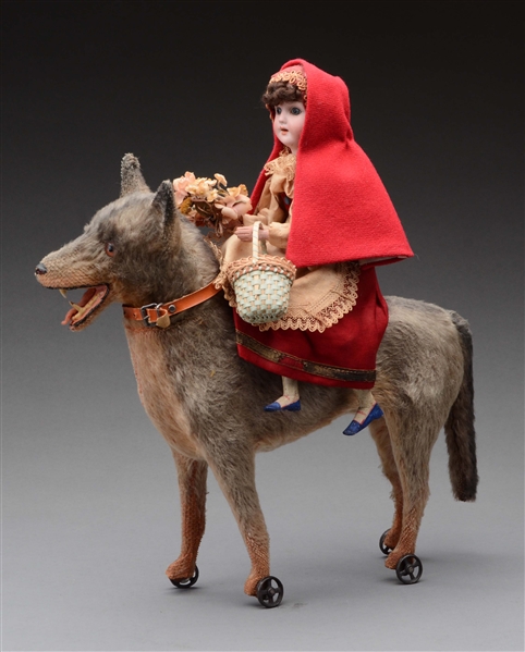 LITTLE RED RIDING HOOD ON A WOLF PULL TOY.