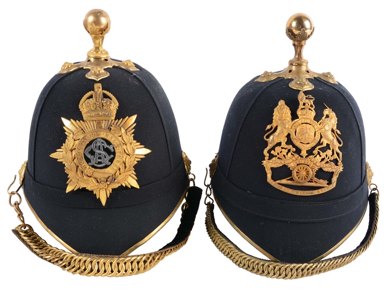 LOT OF 2: CASED BRITISH PATTERN 1878 OFFICERS HOME SERVICE HELMETS.
