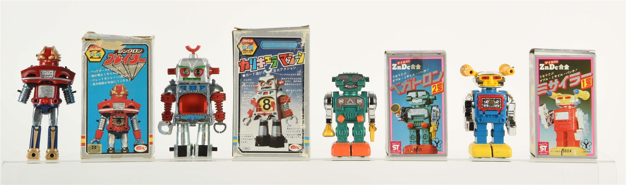LOT OF 4: 70S & 80S JAPANESE DIE-CAST ROBOT & CHARACTER TOYS IN BOXES. 