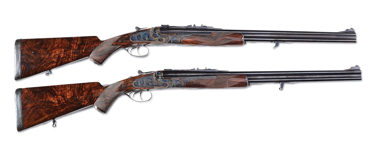 (M) INCREDIBLE MATCHED PAIR OF BOSS TYPE OVER UNDER SIDELOCK EJECTOR DOUBLE RIFLES BY CHARLES LANCASTER, ENGRAVED BY MARTIN BUBLIK WITH SCOPES